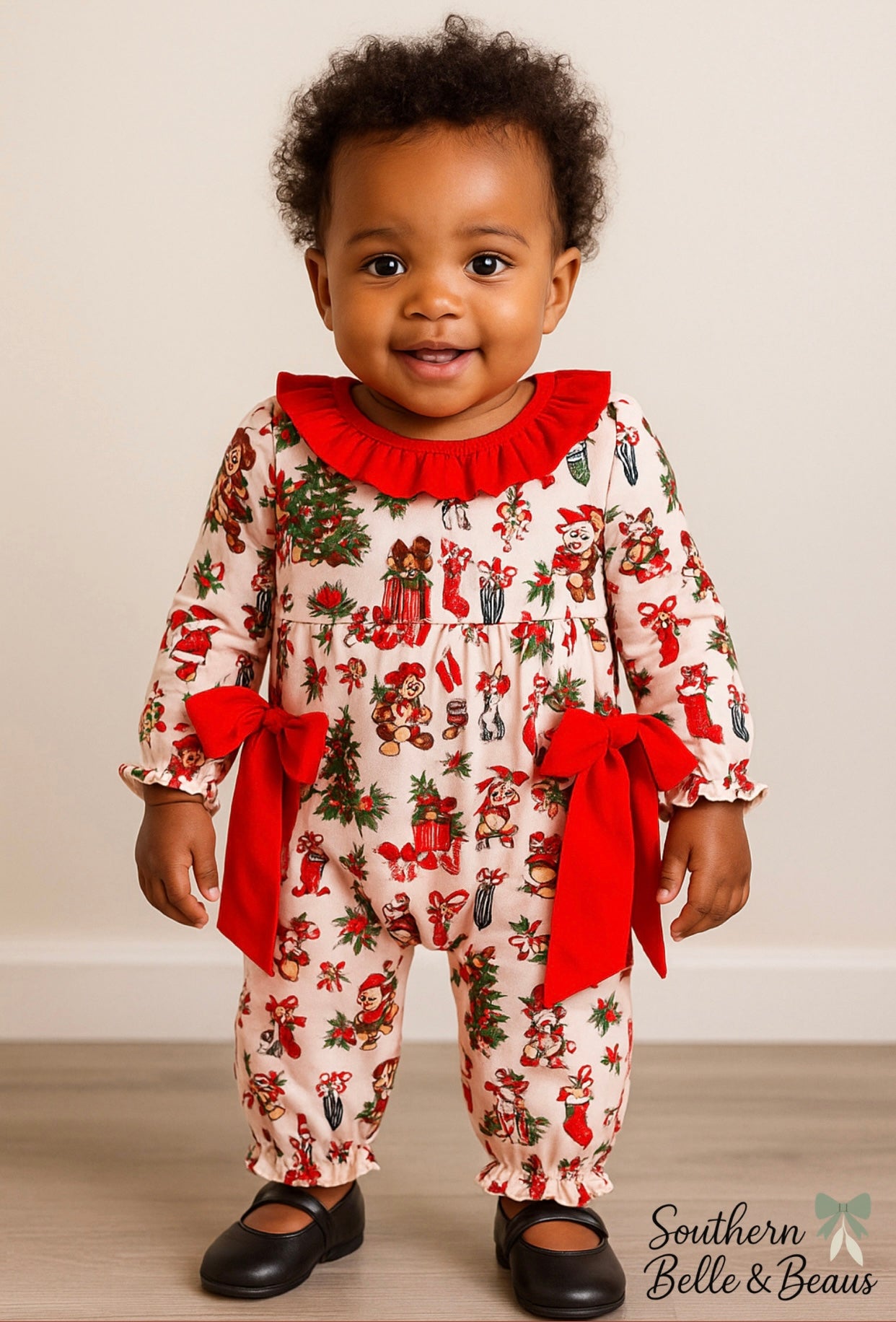 Festive vintage Christmas romper with red bows on the side, snaps for easy accessibility.