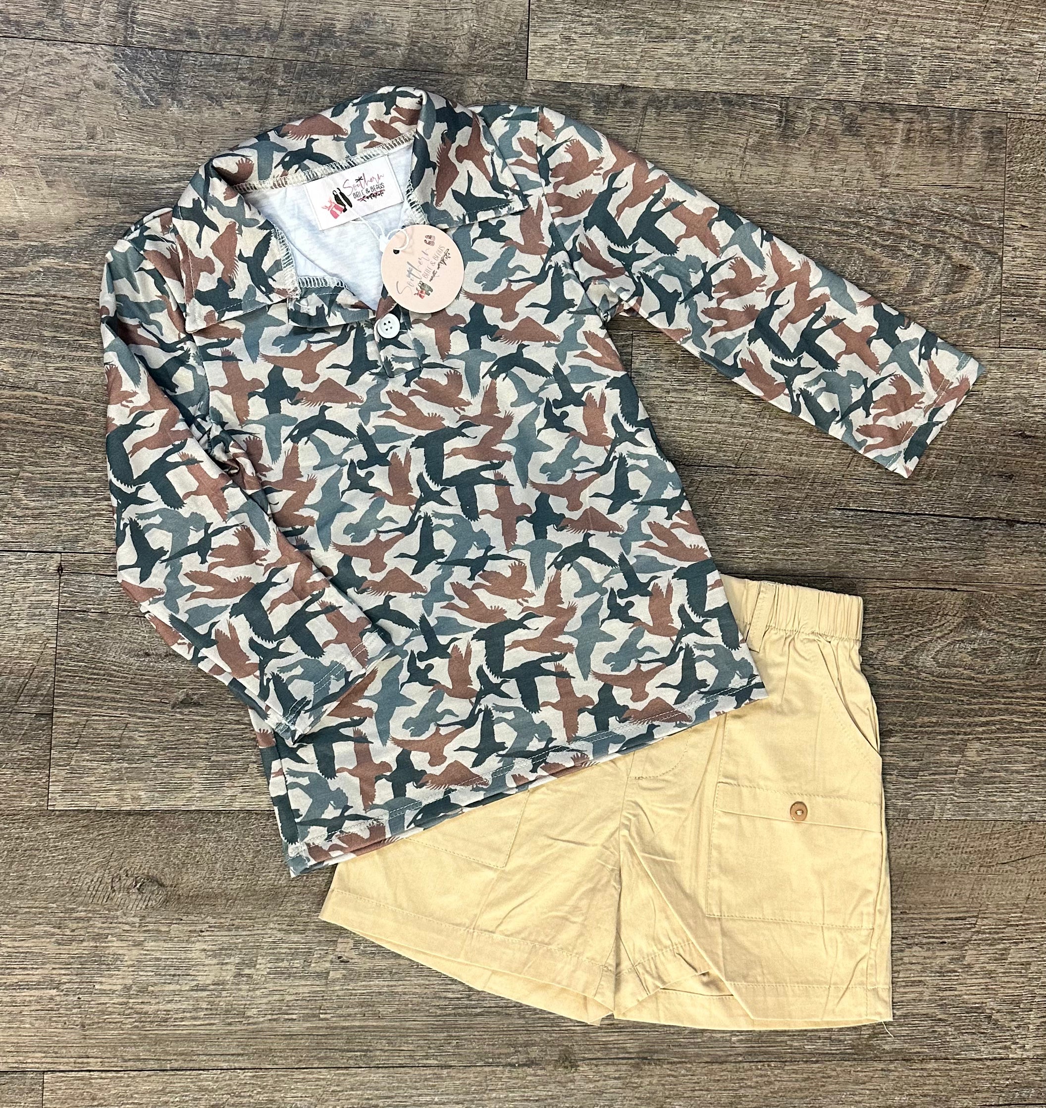 A long-sleeved camouflage polo shirt for boys featuring a bold pattern of flying ducks.