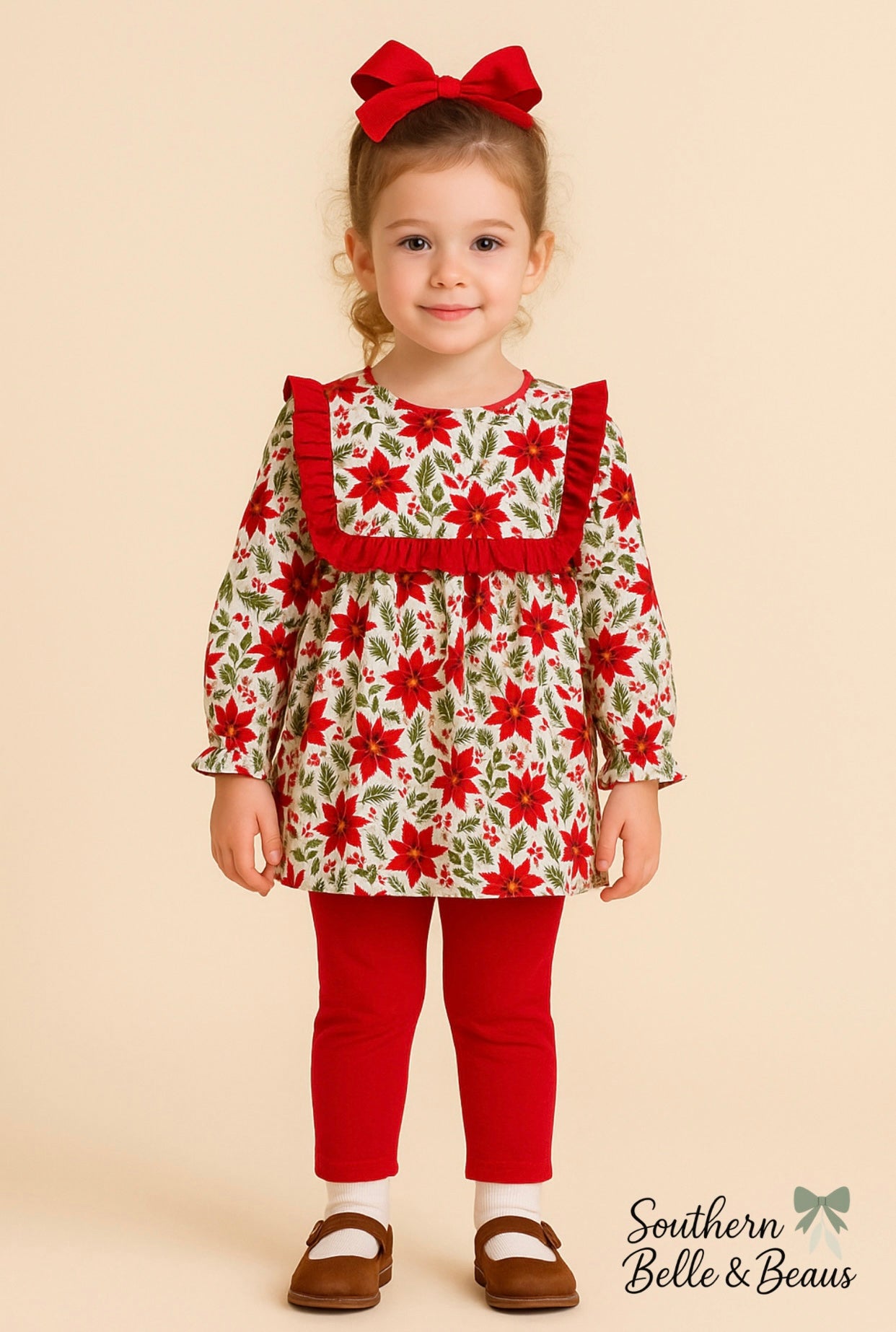 Girls long sleeve outfit with mistletoe floral print, collar trimmed in red ruffles with red pants.