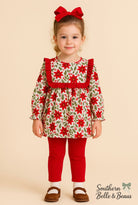 Girls long sleeve outfit with mistletoe floral print, collar trimmed in red ruffles with red pants.