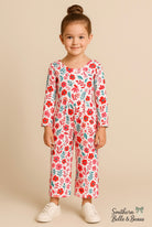 Girls’ long-sleeve jumpsuit with pink, red, and teal floral.