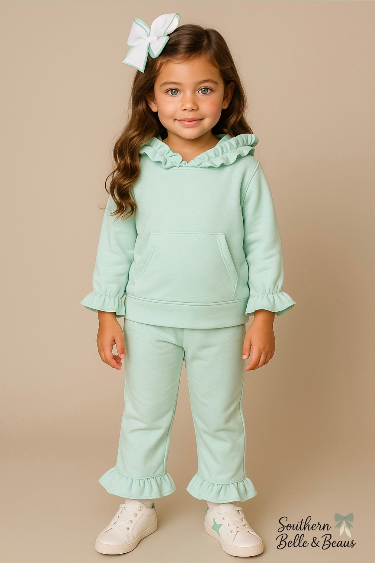 Mint ruffle hooded top with matching flare jogger pants.