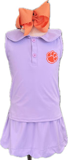 Lavender dress with orange bow and paw print on a white background