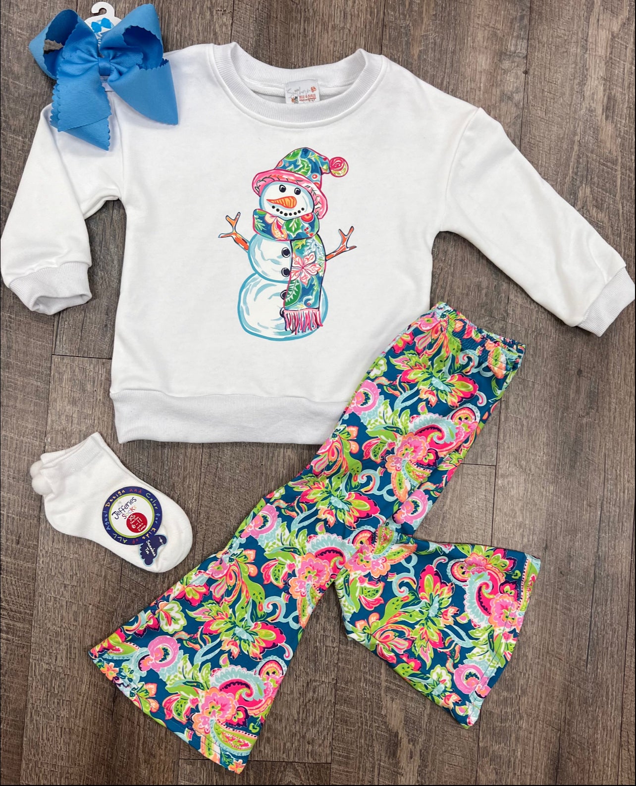 Girls long sleeve tropical Frosty the Snowman with matching floral print flared legged pants.