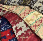 Stack of patterned fabric swatches in various colors and designs.