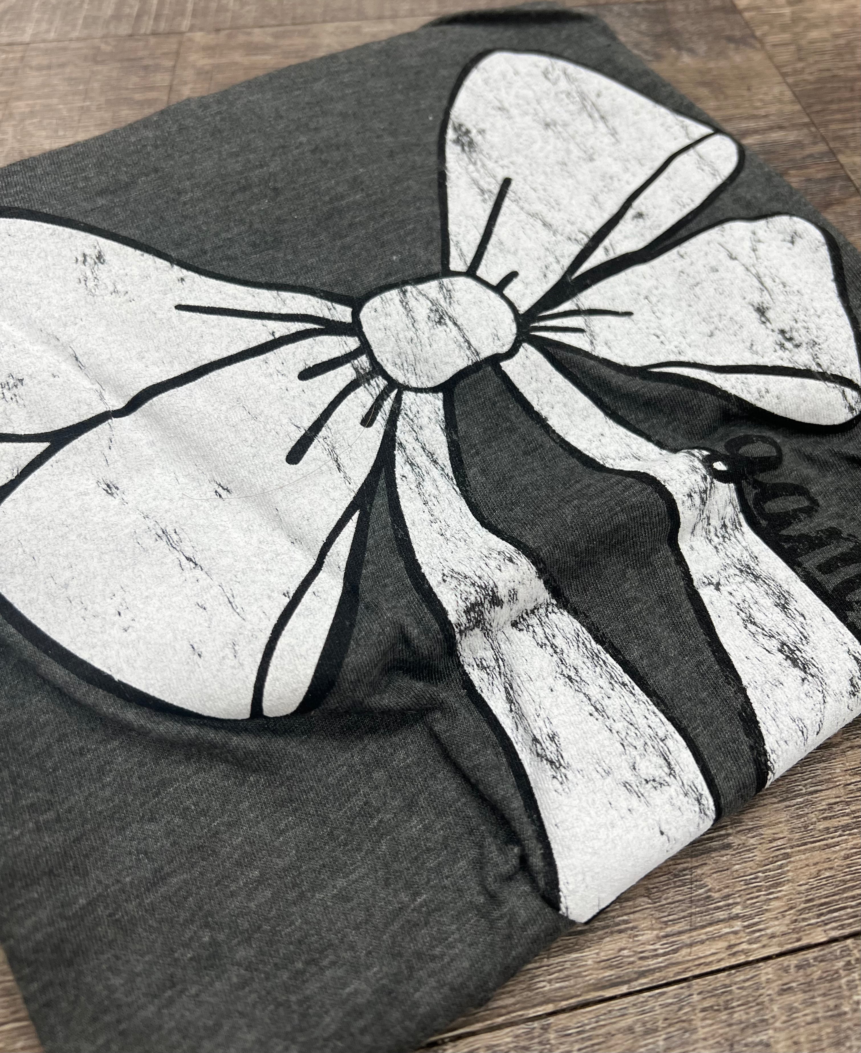 grey t-shirt with white bow outlined in black with game time written on the side of the bow