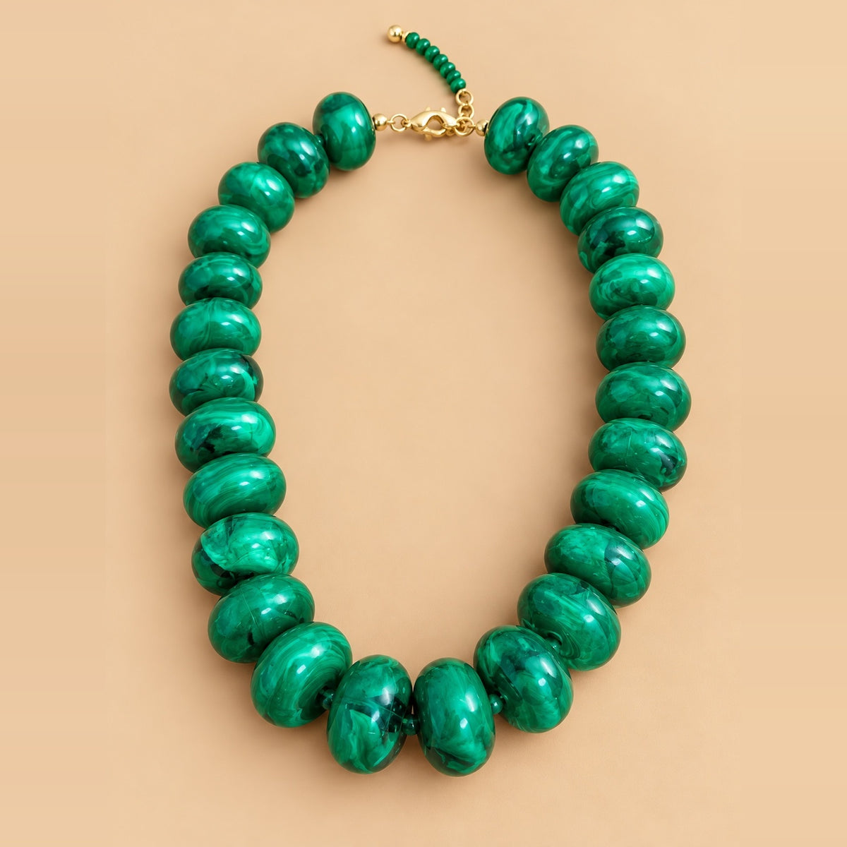Emerald green beaded disk necklace.