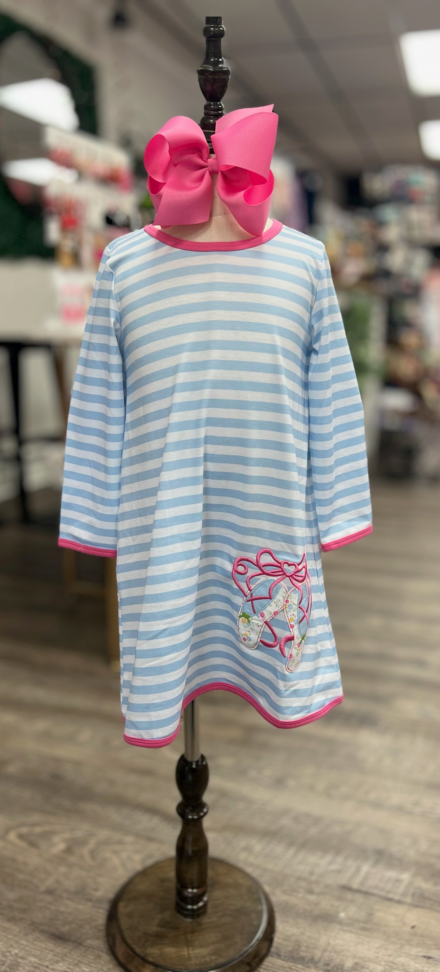 Light blue and white striped girls' dress with hot pink trim and embroidered floral ballet shoes applique'.