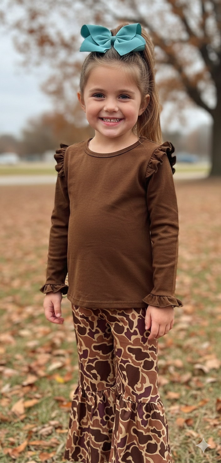 Girl in a brown shirt and flare camo athletic pants