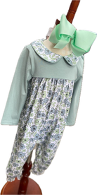 Little girl's long sleeve sage romper with floral print and matching floral print collar.