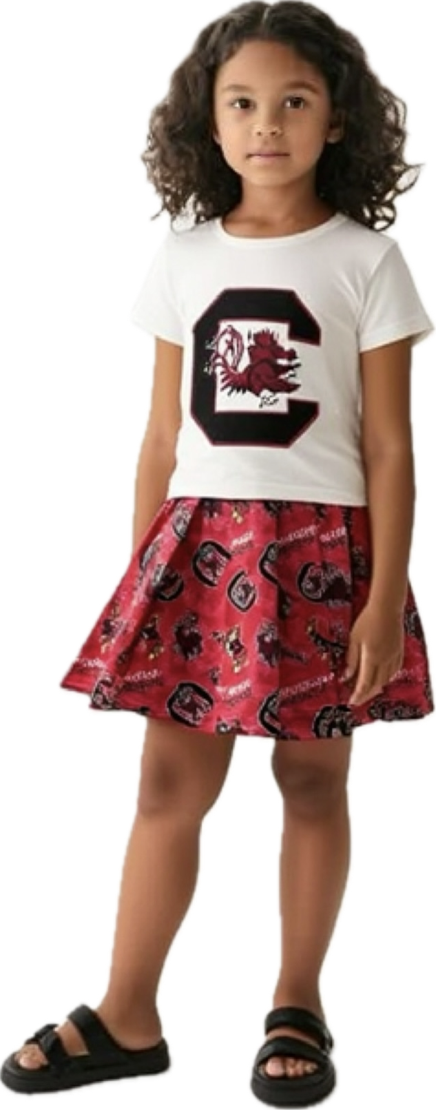 Young girl wearing a white t-shirt with a logo and a red skirt with a similar logo design.