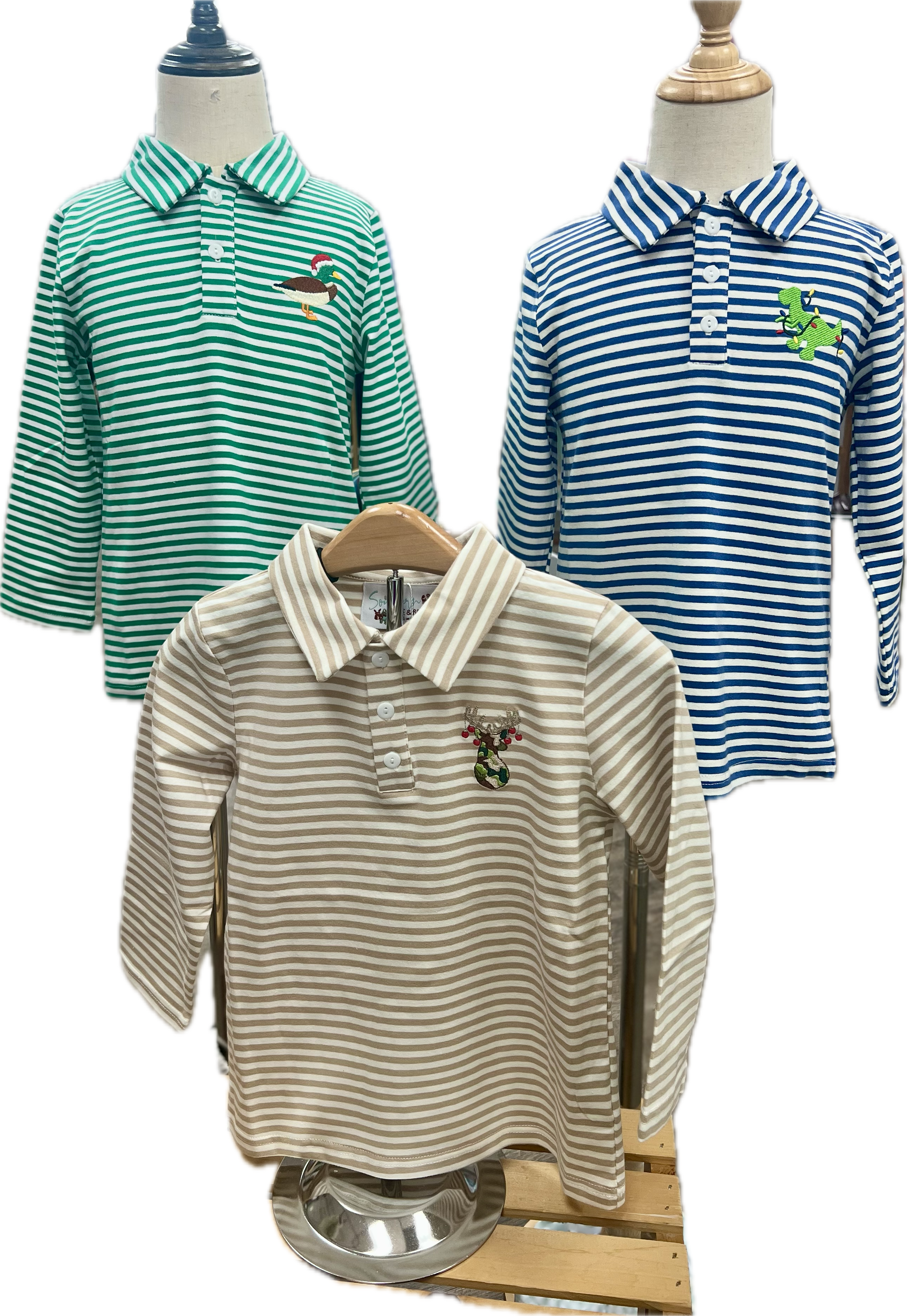 Three striped polo shirts on mannequins with a white background