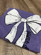 purple t-shirt with white bow outlined in black with game time written on the side of the bow