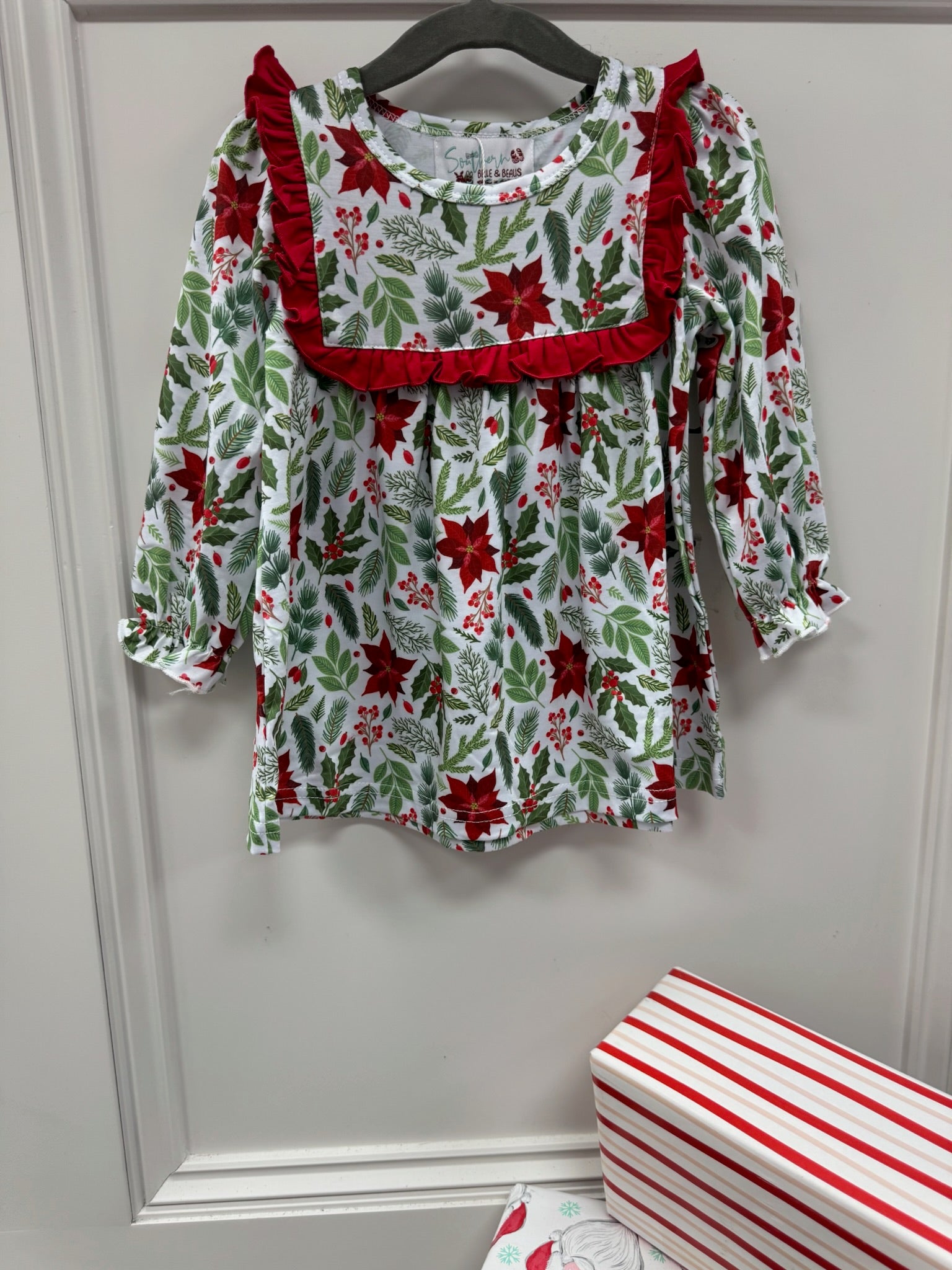 Long sleeve Christmas themed mistletoe print dress with collar trimmed with red ruffles. 