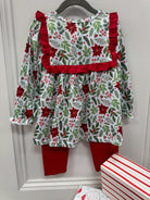 Girls long sleeve outfit with mistletoe floral print, collar trimmed in red ruffles with red pants.