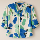 Women’s button-up blouse in soft watercolor shades of blue and green with a mandarin collar and green piping trim.