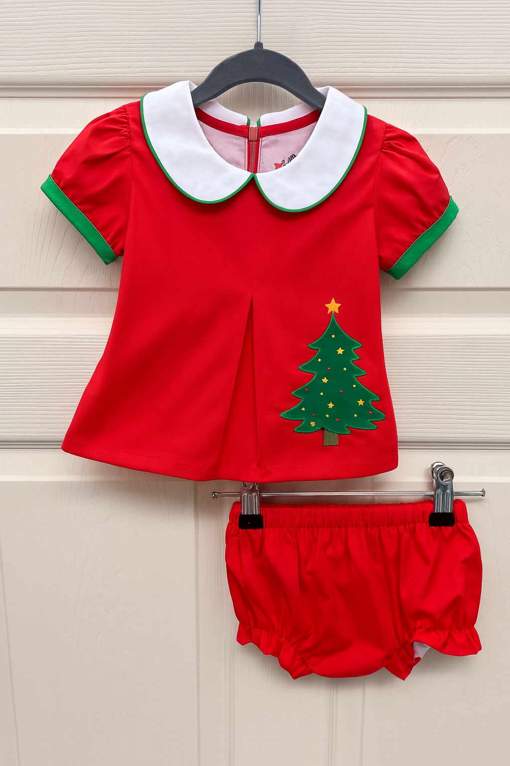 Red baby Christmas diaper set with white Peter Pan collar, green trim, and Christmas tree applique.