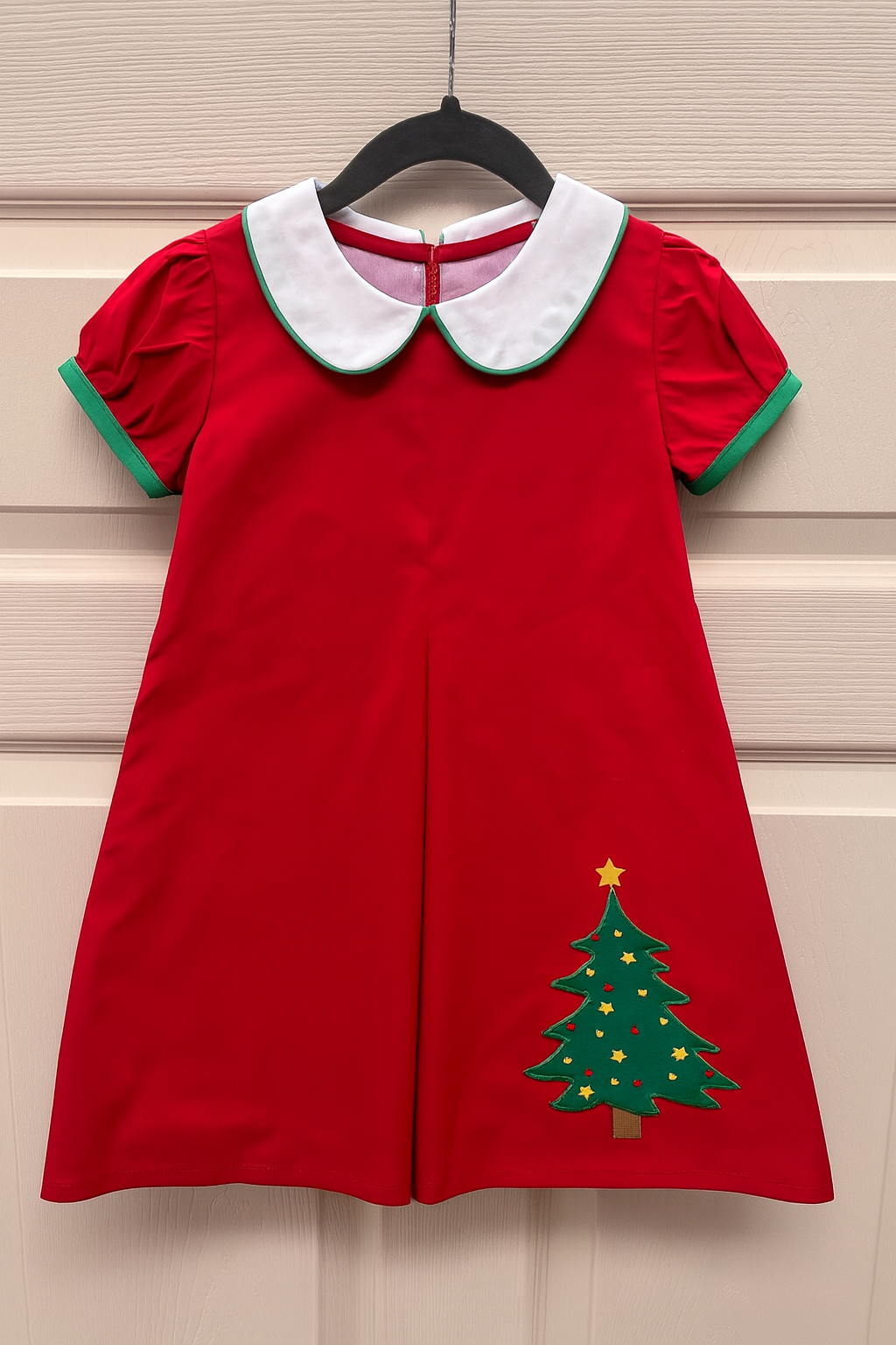 Red girls Christmas dress with white Peter Pan collar, green trim, and Christmas tree applique.