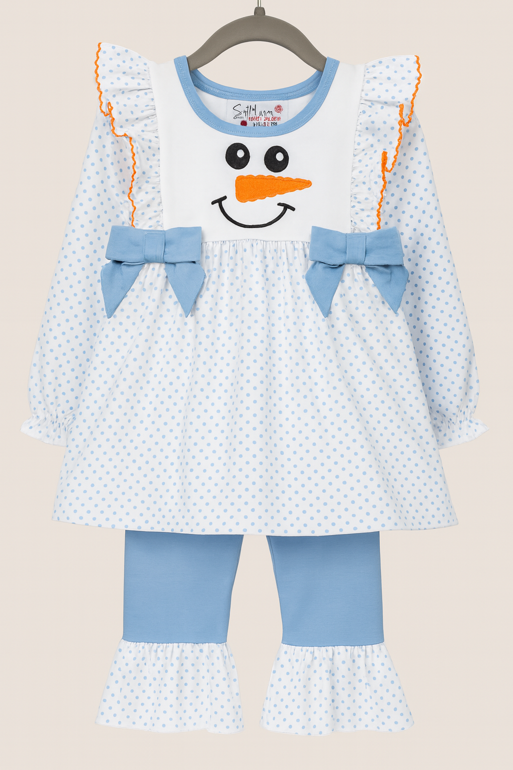 Light blue girls’ two-piece outfit with snowman applique top and matching polka-dot ruffle pants, styled for holiday and winter wear.
