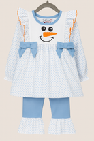 Light blue girls’ two-piece outfit with snowman applique top and matching polka-dot ruffle pants, styled for holiday and winter wear.