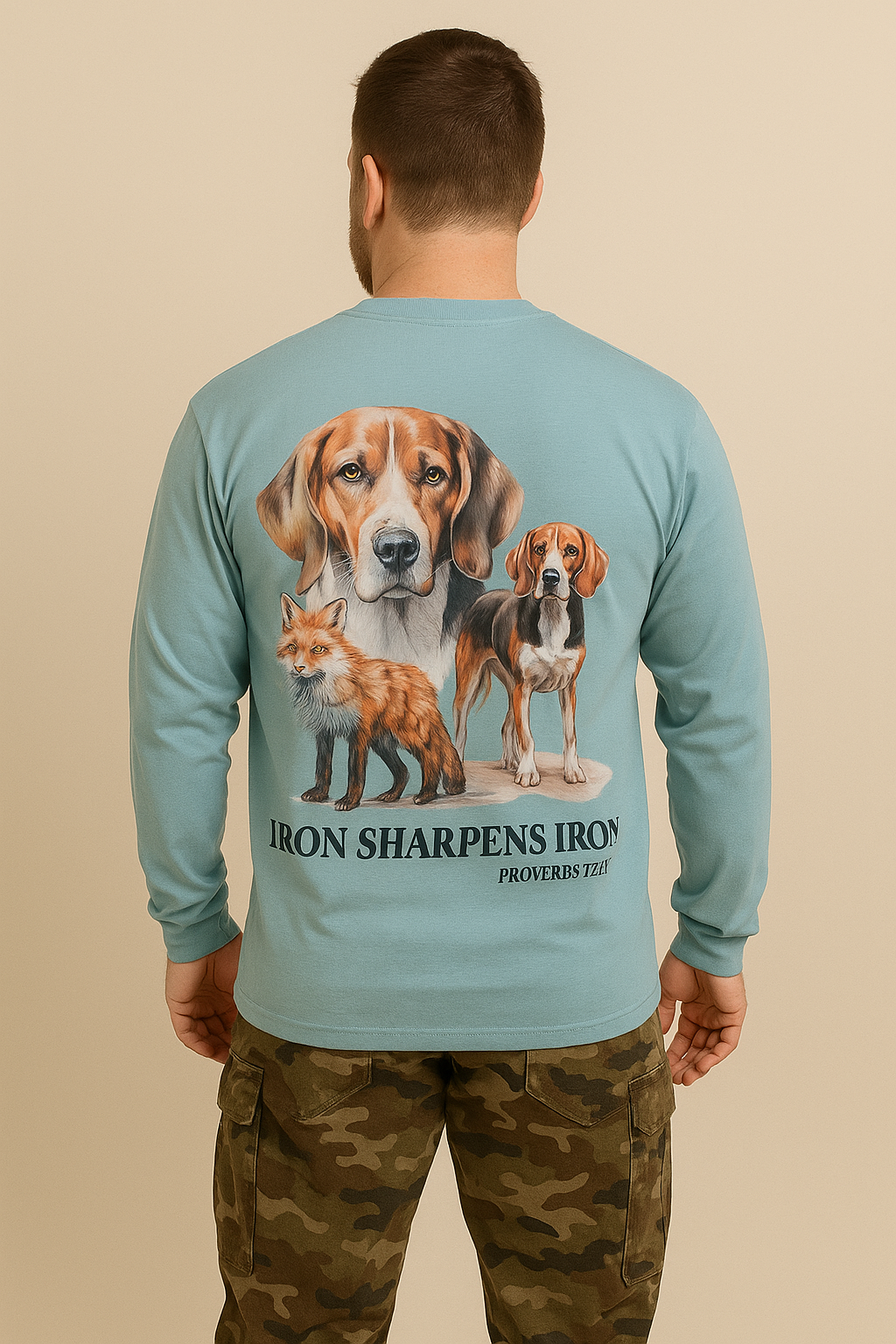 Man wearing a long-sleeve shirt with a graphic of two dogs and a fox, and text on the back.