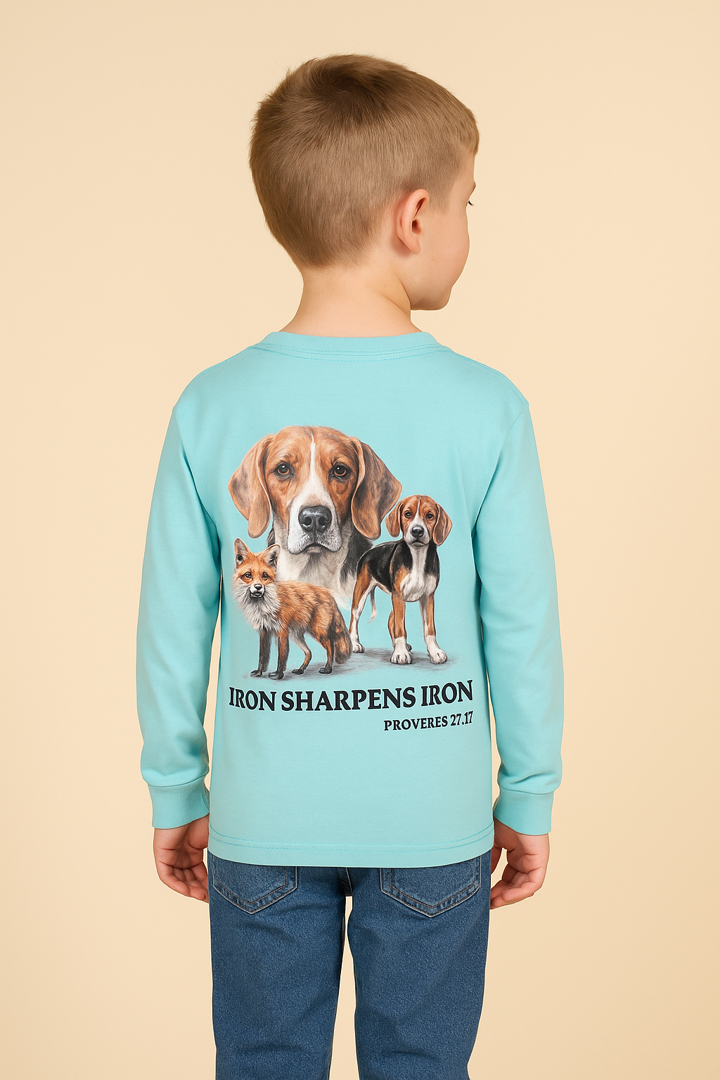 Child wearing a light blue long-sleeve shirt with dog illustrations and text on the back.