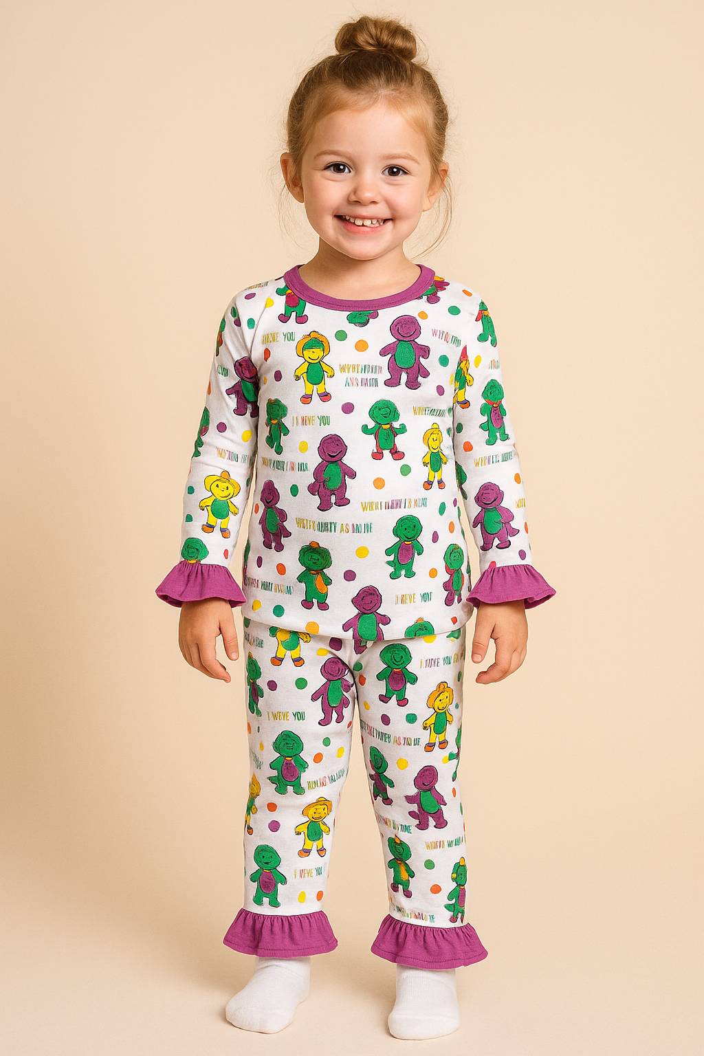 Child wearing a colorful pajama set with cartoon characters on a beige background