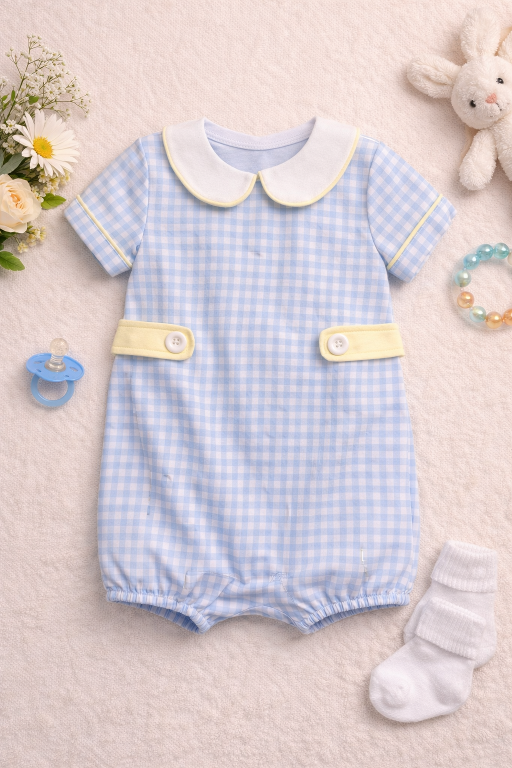 Baby romper with checkered pattern on a neutral background
