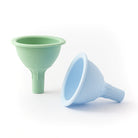 Two silicone funnels, one green and one blue, on a white background