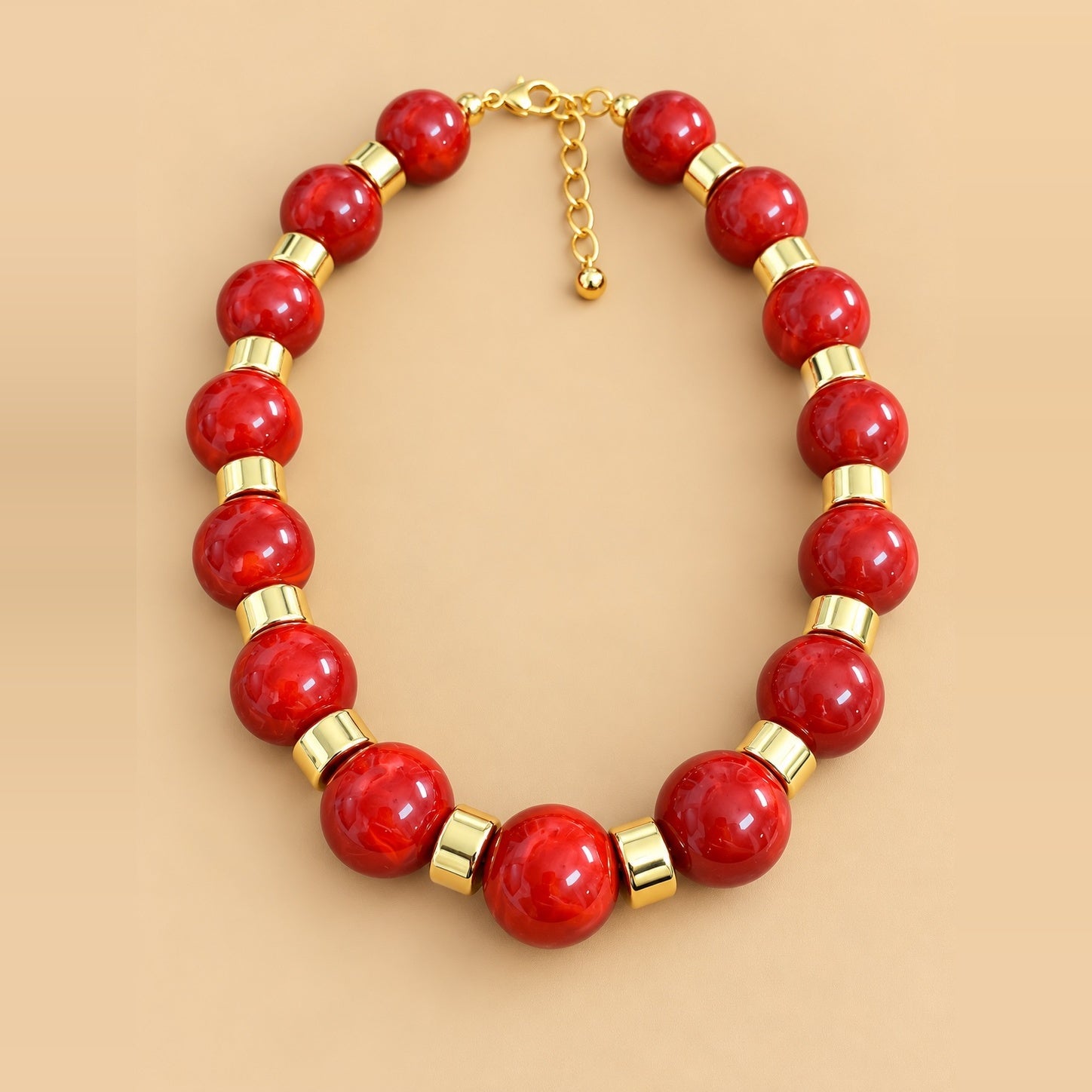  Cherry Red Gold Bead Necklace is a women's red beaded statement necklace with gold-tone spacers.