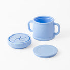 Set of blue silicone cups with lids on a white background