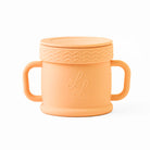 Orange children's sippy cup with lid on a white background