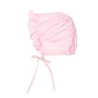 Pink baby bonnet on a white background