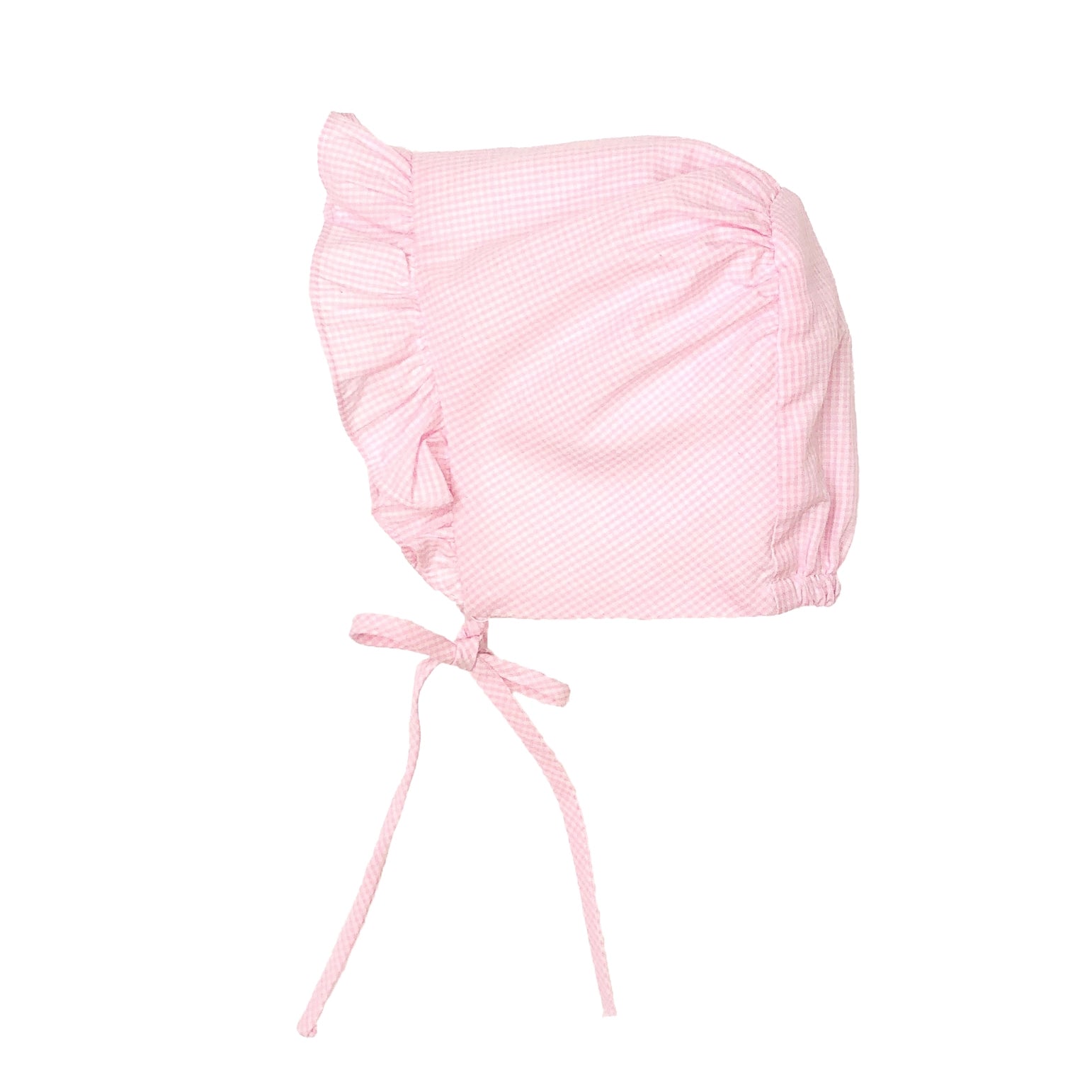 Pink baby bonnet on a white background