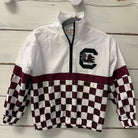 A white and maroon checkered quarter-zip windbreaker jacket hanging on a white wooden wall. The jacket features a solid white upper section, a maroon horizontal stripe, and a maroon and white checkerboard pattern across the lower body and sleeves.