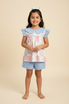 Hispanic Girl in Patchwork Tunic Top and Side Ruffle Shorts