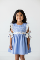 Native American girl wearing Thank Heaven for Little Girls embroidered flutter sleeve dress - front view