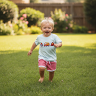 Flame Fighters Short Set lifestyle - toddler boy running in backyard