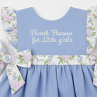 Close-up of embroidered bodice and flutter sleeve detail