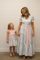 Mama & girl holding hands