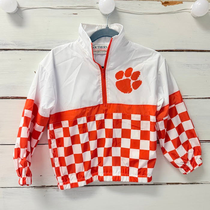 Kids orange and white checkered windbreaker with embroidered paw logo, front view